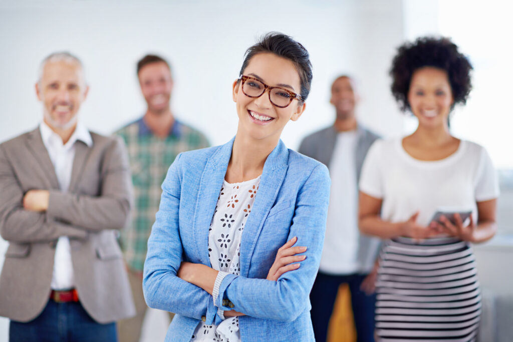 Confident professional leading a team, representing a successful new hire ready to make an impact.